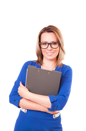 Portrait of a woman in glasses and with folder in her hands, isolated on white backgroundの写真素材