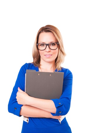 Portrait of a woman in glasses and with folder in her hands, isolated on white backgroundの写真素材