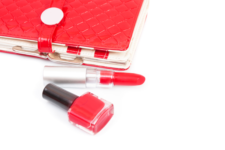 Red nail polish and brush dripping. Isolated on whiteの写真素材