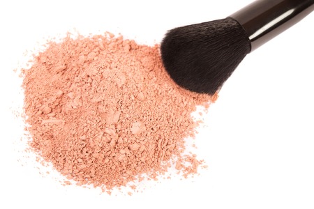 Powder blush and black makeup brush on white backgroundの写真素材
