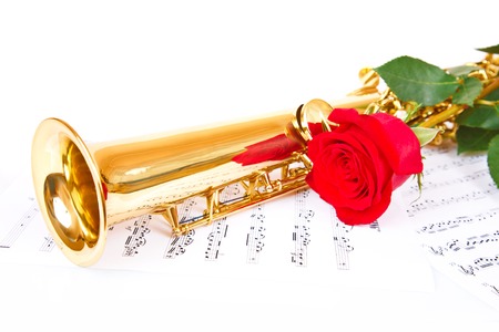 Musical notes and saxophone with red roseの写真素材