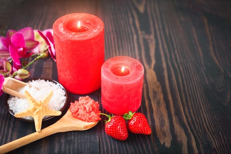Strawberry body scrub with brown sugar and sea salt on the wooden backgroundの写真素材