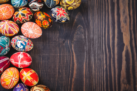 Easter eggs on a dark wooden background.の写真素材
