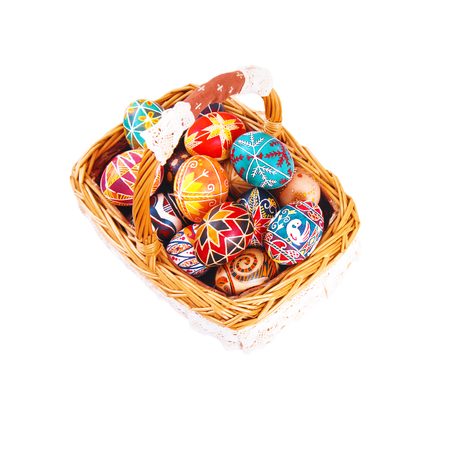 Easter eggs in a basket, isolated on a white background. Symbol of Christian holidays.の写真素材
