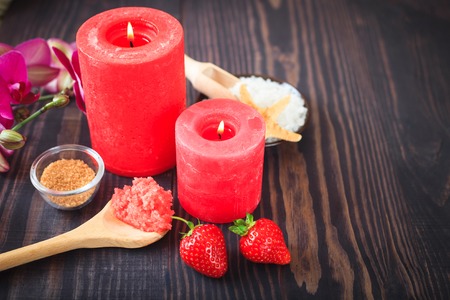 Strawberry body scrub with brown sugar and sea salt on the wooden backgroundの写真素材