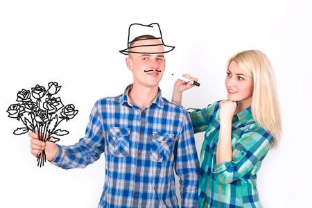 Woman and man with a drawn bouquet in the studio on a white background.の写真素材