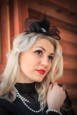 Outdoor fashion portrait woman, vintage close up, red lips, make up in retro style.の写真素材