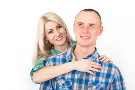 Studio portrait of a happy smiling couple hugging on a white background.の写真素材