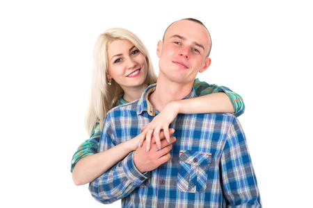Studio portrait of a happy smiling couple hugging on a white background.の写真素材