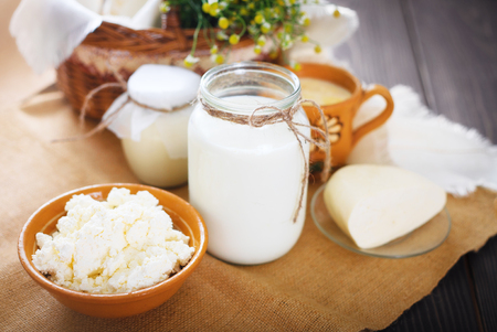 Assorted dairy products milk, yogurt, cottage cheese, sour cream. Rustic still life. Farmer's cow dairy products.の写真素材