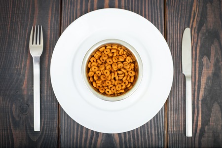 Cat food and cutlery on a wooden table. The concept of pet food.の写真素材