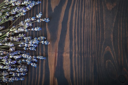 Bunch of dried lavender on wooden background.の写真素材