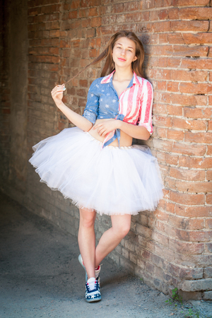 Portrait of teen girl in a bright clothes outdoorsの写真素材