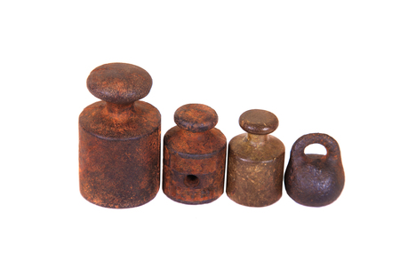 Old and rusty weights on white background close up.の写真素材