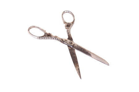 Rusty scissors isolated on a white background.