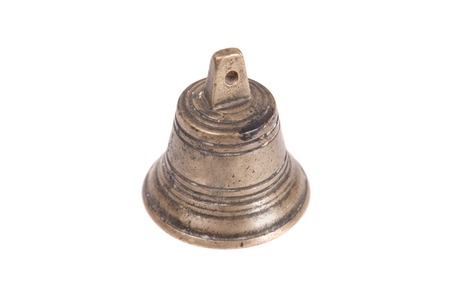 Ancient bell on a white background close-up.の写真素材