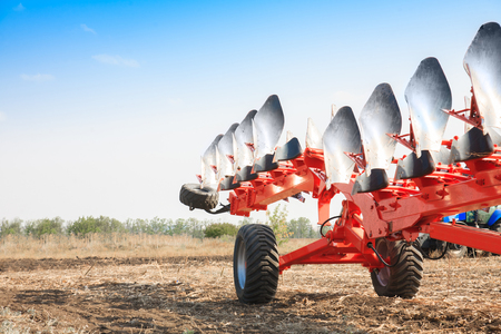 Agricultural plow close-up on the ground, farm equipmentの写真素材