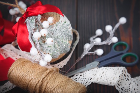 Making a toy for a Christmas tree. Handmade New Year decor. Copy space.の写真素材