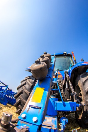 Close up of tractor on a blue sky backgroundの写真素材