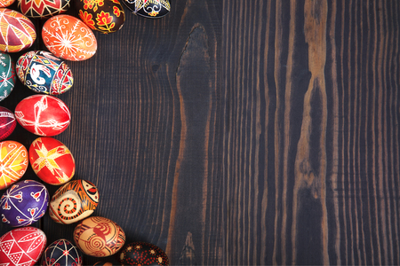 Easter decorated eggs on a wooden background. Copy space, easter background.の写真素材
