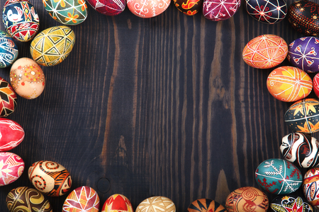Easter decorated eggs on a wooden background. Copy space, easter background.の写真素材