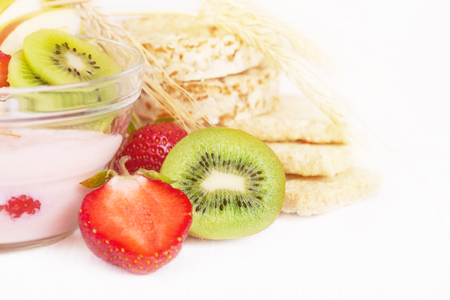 Yogurt with exotic fruits and cereals on a white backgroundの写真素材