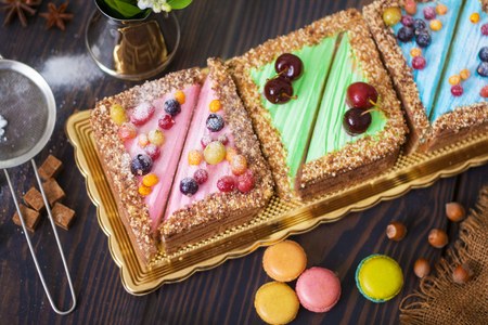 Colored cakes on the table. Coffee and dessert for breakfast. Close-up.の写真素材