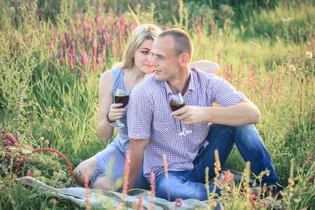 Picnic - Romantic happy couple in meadows nature sunny dayの写真素材