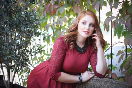 Young and beautiful woman in in evening dress outdoors. Autumn fashion concept.