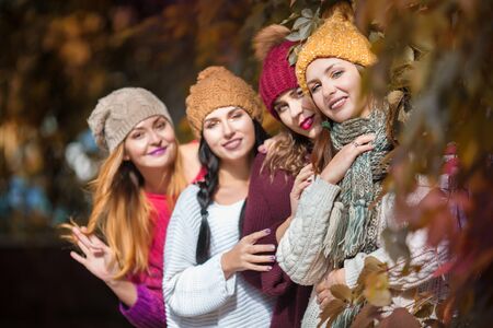 Women best friends smiling and walking at the nature. Outdoors lifestyle fashion portrait. Positive emotions.の写真素材