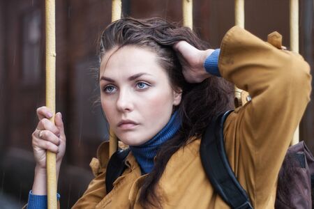 Portrait of a sad woman outdoors closeup.の写真素材
