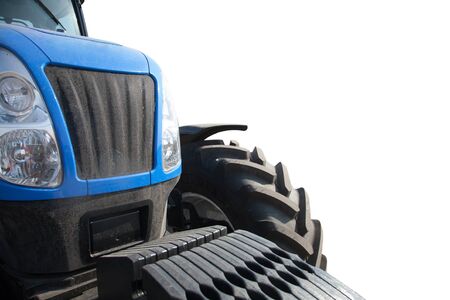 Blue tractor isolated on white background close-up.の写真素材