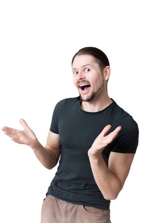 Cheerful gesturing man in studio isolated on a white background. Portrait of a funny guy.の写真素材