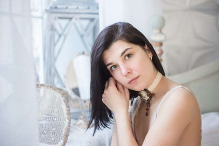 Closeup woman portrait, morning bride, beautiful young woman in the bedroom.の写真素材