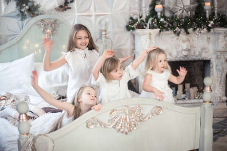 Girls sisters in winter morning drink tea winter christmas new year.の写真素材