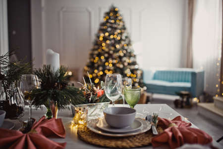 New Year's Christmas table, setting for a festive dinner. Home interior. Winter holidays.の写真素材