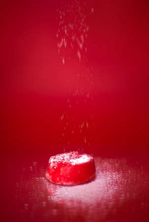 Japanese oriental rice dessert mochi on a red background close-up, studio photo.の写真素材