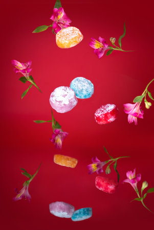 Japanese oriental rice dessert mochi on a red background close-up, studio photo.の写真素材