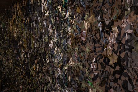 Handmade military camouflage net close up.