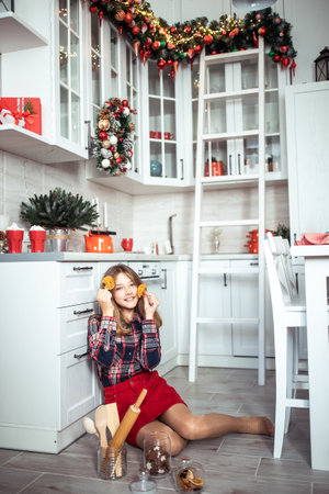 Cute teenage girl in a room with a decorated Christmas tree. The winter holidays. high quality photoの写真素材