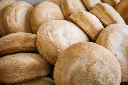 A lot of bread on a tray in a bakery, closeupの写真素材