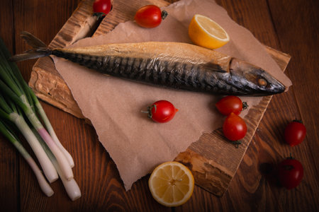Mackerel on the table with vegetables. Home cooking, fish menu.の写真素材