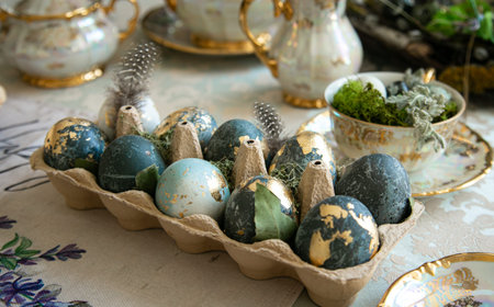 Painted Easter eggs are on a served table, spring photo.