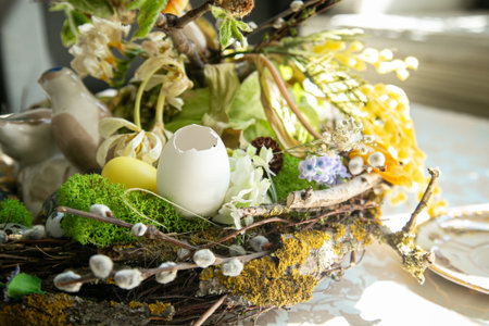 Painted Easter eggs are on a served table, spring photo.