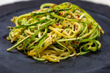 Zucchini spaghetti with dehydrated pepperoni pepper.の写真素材