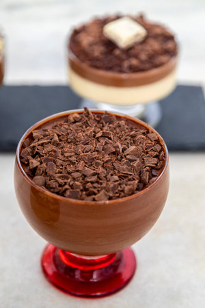 Milk chocolate mousse with chocolate shavings.