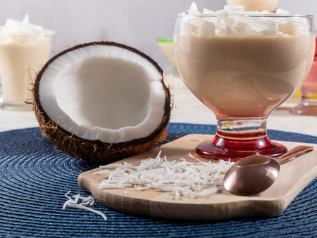 Delicious coconut mousse in glass cup.