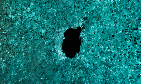 Broken transparent glass into small pieces.の写真素材