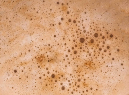 Texture of freshly brewed coffee foam with cream