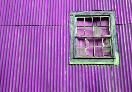 Broken old window on a purple wallの写真素材
